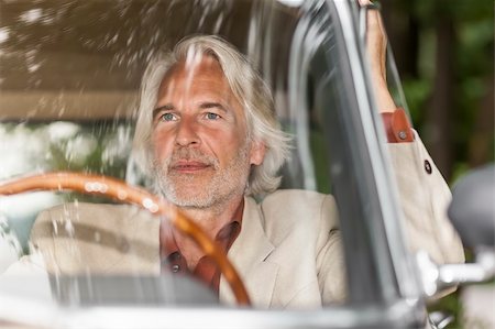 senior eyes - An image of a man in his historic car Stock Photo - Budget Royalty-Free & Subscription, Code: 400-06393461