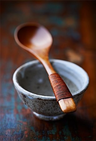 dark wooden background - bamboo spoon on a ceramic tea cup Stock Photo - Budget Royalty-Free & Subscription, Code: 400-06393702