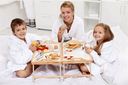 family cheese - Happy morning - woman and kids having a light brekfast in bed Stock Photo - Budget Royalty-Free & Subscription, Code: 400-06408420