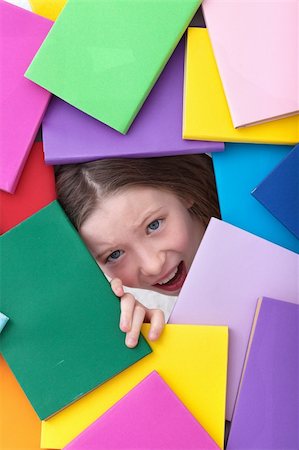 picture female under hair - Covered by too much information - young girl emerging from beneath books Stock Photo - Budget Royalty-Free & Subscription, Code: 400-06408452