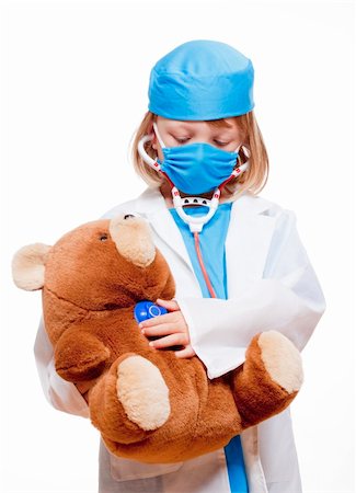 boy with long blond hair playing a doctor Stock Photo - Budget Royalty-Free & Subscription, Code: 400-06414359