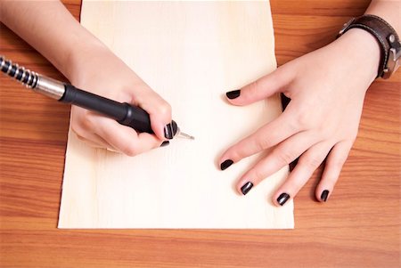 Close up of female hands doing engraving with electric grinder Stock Photo - Budget Royalty-Free & Subscription, Code: 400-06414366