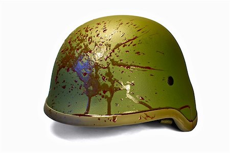Military or police helmet with blood splattered. Isolated. Clipping path. Foto de stock - Super Valor sin royalties y Suscripción, Código: 400-06414927