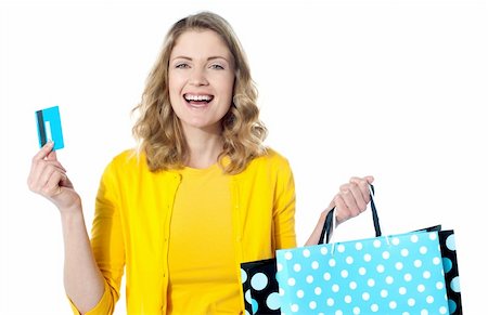 Happy shopaholic female laughing. Holidng credit-card and shopping bags Fotografie stock - Microstock e Abbonamento, Codice: 400-06415808