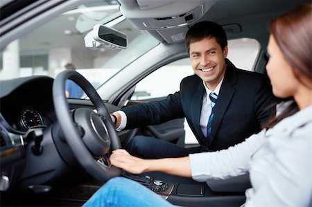 Woman in the car and seller at a showroom Stock Photo - Budget Royalty-Free & Subscription, Code: 400-06415921