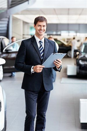 simsearch:400-06415950,k - Salesman in the showroom Stock Photo - Budget Royalty-Free & Subscription, Code: 400-06415930