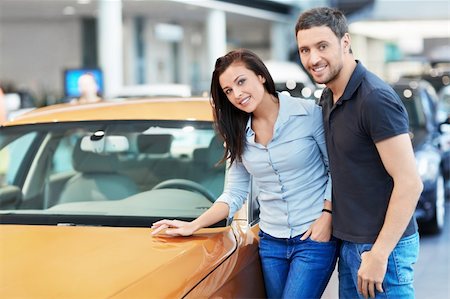 simsearch:400-06415950,k - Attractive couple chooses a car Stock Photo - Budget Royalty-Free & Subscription, Code: 400-06415949