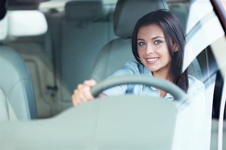 driving new car - Beautiful girl at the wheel a car Stock Photo - Budget Royalty-Free & Subscription, Code: 400-06415955