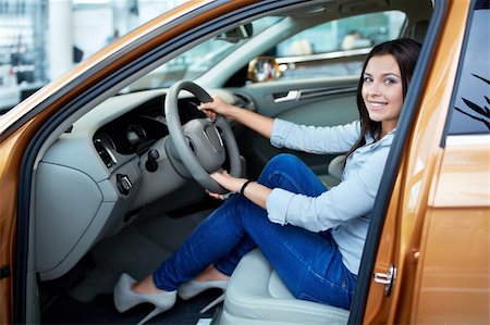 driving new car - Beautiful girl at the wheel a car Stock Photo - Budget Royalty-Free & Subscription, Code: 400-06415956