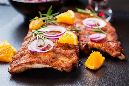 flame grilled pork ribs - BBQ spare ribs marinated in orange sauce with herbs and wine Stock Photo - Budget Royalty-Free & Subscription, Code: 400-06416348