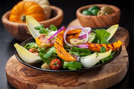 Delicious field salad with grilled pumpkin stripes for Thanksgiving Stock Photo - Budget Royalty-Free & Subscription, Code: 400-06416359