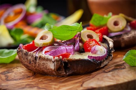 Giant Portobello mushrooms stuffed with mozzarella and tomatoes Stock Photo - Budget Royalty-Free & Subscription, Code: 400-06416361