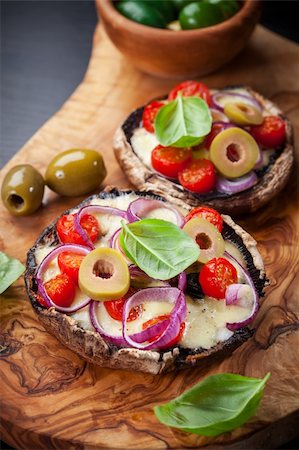 Giant Portobello mushrooms stuffed with mozzarella and tomatoes Stock Photo - Budget Royalty-Free & Subscription, Code: 400-06416362