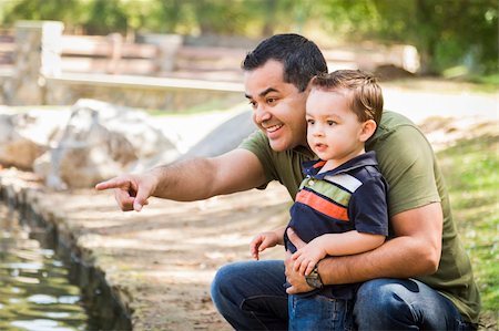 feverpitched (artist) - Happy Hispanic Father Points with Mixed Race Son at the Park Pond. Foto de stock - Royalty-Free Super Valor e Assinatura, Número: 400-06417109