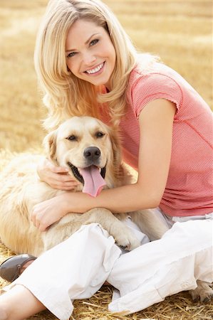 simsearch:400-04026987,k - Woman Sitting With Dog On Straw Bales In Harvested Field Stock Photo - Budget Royalty-Free & Subscription, Code: 400-06417577