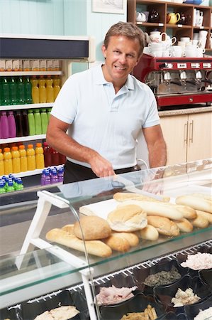 retail sandwich - Man Working Behind Counter In Caf? Stock Photo - Budget Royalty-Free & Subscription, Code: 400-06417722