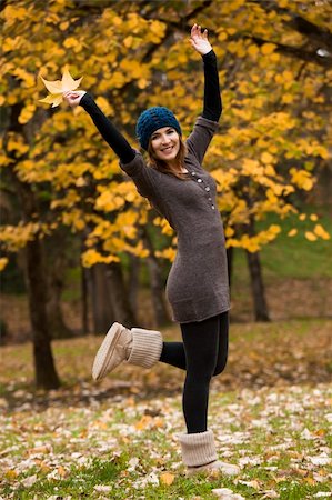 Happy woman in a beautiful autumn day Stock Photo - Budget Royalty-Free & Subscription, Code: 400-06417967