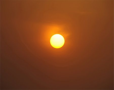 A golden glowing sun in the sky Stock Photo - Budget Royalty-Free & Subscription, Code: 400-06417989