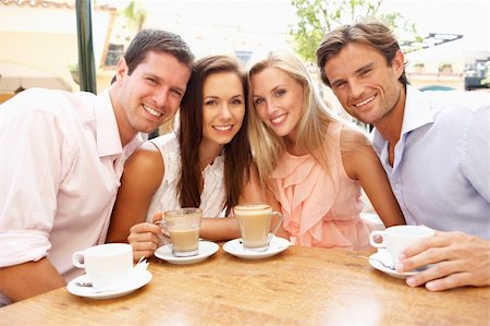Group Of FriendsEnjoying Coffee In Caf? Stock Photo - Budget Royalty-Free & Subscription, Code: 400-06418602