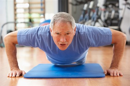 Senior Man Doing Press Ups In Gym Stock Photo - Budget Royalty-Free & Subscription, Code: 400-06418695