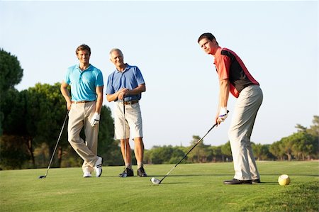 senior man and young man sports - Group Of Male Golfers Teeing Off On Golf Course Stock Photo - Budget Royalty-Free & Subscription, Code: 400-06418816