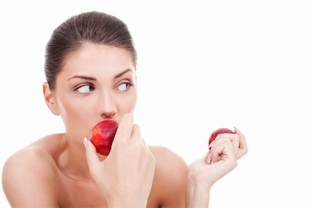 beautiful woman eating peaches and looking to her side over white Stock Photo - Budget Royalty-Free & Subscription, Code: 400-06419169