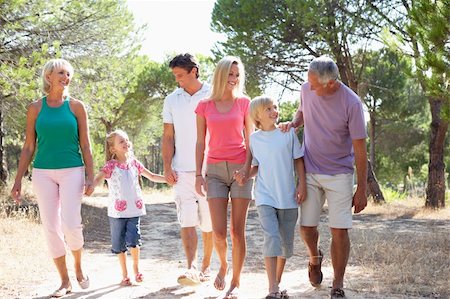 A family, with parents, children and grandparents, walk through park Stock Photo - Budget Royalty-Free & Subscription, Code: 400-06419297