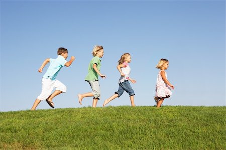 Young children running through field Stock Photo - Budget Royalty-Free & Subscription, Code: 400-06419310