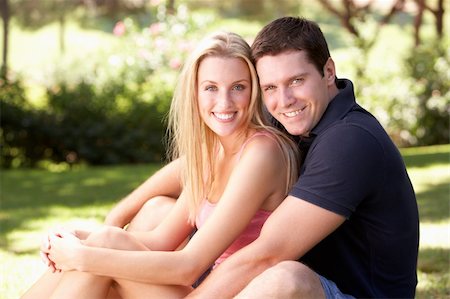 Portrait Of Young Couple Relaxing In Park Stock Photo - Budget Royalty-Free & Subscription, Code: 400-06419528