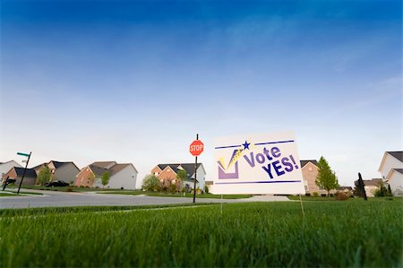stop sign intersection - Image of a lawn sign in a neighborhood reading Vote Yes Stock Photo - Budget Royalty-Free & Subscription, Code: 400-06413511