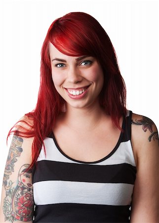 Hübsche junge Frau mit roten Haaren, Tätowierung und gestreifter Pullunder Stockbilder - Microstock & Abonnement, Bildnummer: 400-06424186