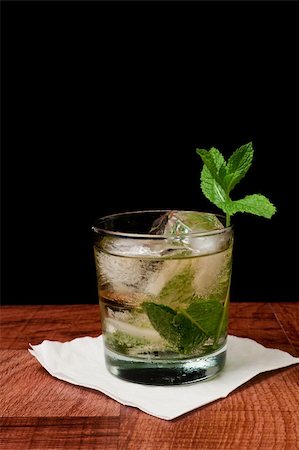 Mint julep isolated on a black background served on a bar top garnished with fresh mint Stock Photo - Budget Royalty-Free & Subscription, Code: 400-06424631
