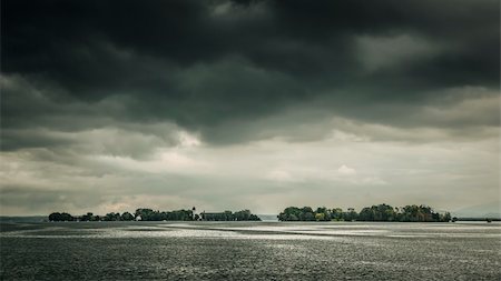 An image of the Chiemsee in Bavaria Germany with a dramtic sky Stock Photo - Budget Royalty-Free & Subscription, Code: 400-06424745