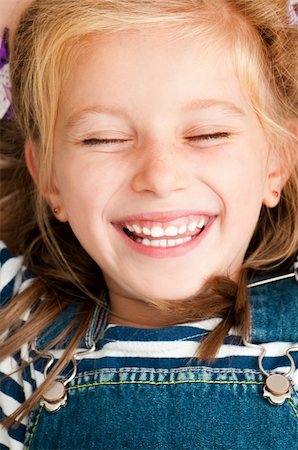 cute smiling girl with closed eyes Stock Photo - Budget Royalty-Free & Subscription, Code: 400-06424838