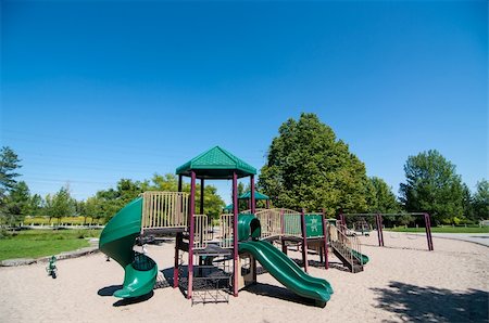 Playground equipment in a sandy play area in a public park. Stock Photo - Budget Royalty-Free & Subscription, Code: 400-06425455