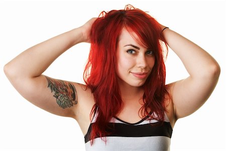 Hübsche junge Europäerin mit roten Haaren und Tätowierung auf hintergrund isoliert Stockbilder - Microstock & Abonnement, Bildnummer: 400-06426510