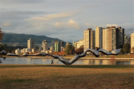 This piece of Public Art in Vanier Park stretches in front of the Burrard Inlet, the West End, and the snow covered Northshore Mountains. Stock Photo - Budget Royalty-Free & Subscription, Code: 400-06426949