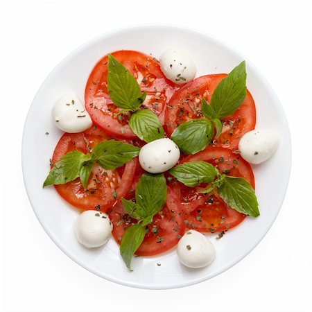 caprese salad on plate directly above isolated on white background Stock Photo - Budget Royalty-Free & Subscription, Code: 400-06427104