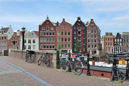 Amsterdam. The bridge across the canal and very beautiful  buildings in the old town Stock Photo - Budget Royalty-Free & Subscription, Code: 400-06427593