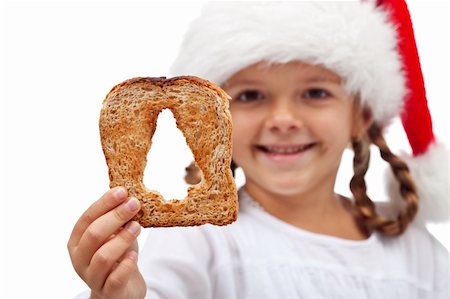 simsearch:400-05701644,k - Merry christmas with plenty of food - child holding bread slice, isolated Stock Photo - Budget Royalty-Free & Subscription, Code: 400-06427830