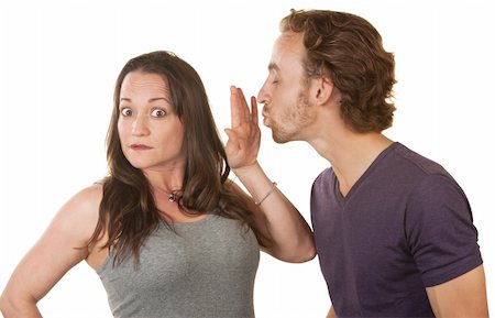 Unhappy woman blocking bearded man's kiss over white background Stock Photo - Budget Royalty-Free & Subscription, Code: 400-06428051