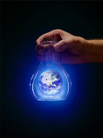 simsearch:700-00158244,k - Man holding an old bottle with a glowing earth. Earth image provided by NASA. Foto de stock - Super Valor sin royalties y Suscripción, Código: 400-06428939