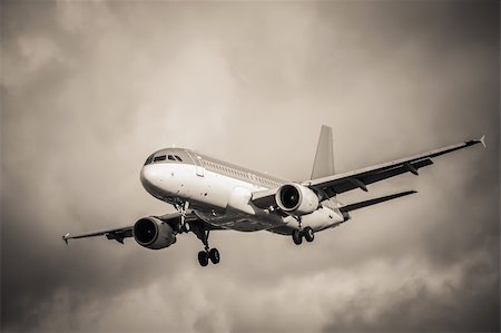 simsearch:400-07933124,k - sepia toned passenger aircraft landing in turbulence Stock Photo - Budget Royalty-Free & Subscription, Code: 400-06429294