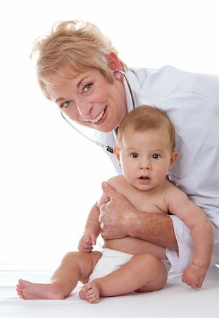 simsearch:400-08935984,k - female doctor checking a baby on white isolated background Stock Photo - Budget Royalty-Free & Subscription, Code: 400-06420090