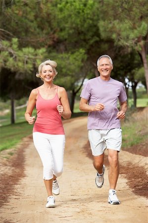 Senior couple running in park Foto de stock - Super Valor sin royalties y Suscripción, Código: 400-06420398