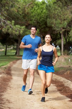 Young couple running in park Stock Photo - Budget Royalty-Free & Subscription, Code: 400-06420403