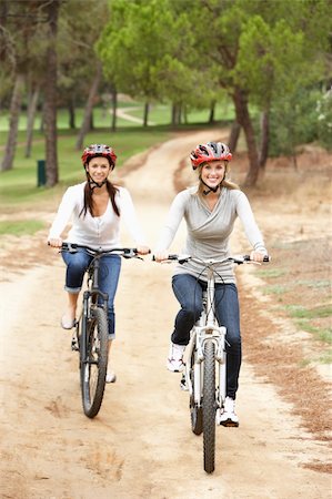 simsearch:6128-08738600,k - Couple riding bicycle in park Stock Photo - Budget Royalty-Free & Subscription, Code: 400-06420419