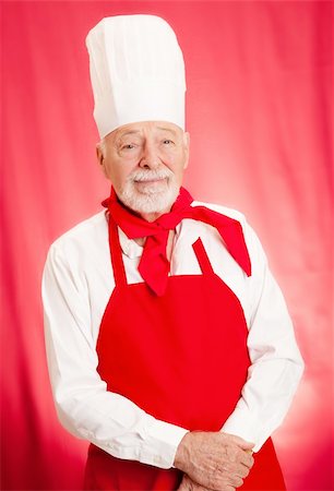 Portrait of handsome chef taken against a red background. Stock Photo - Budget Royalty-Free & Subscription, Code: 400-06420490