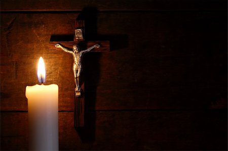 prayer candle and cross - Small crucifix hanging on old wooden wall near lighting candle Stock Photo - Budget Royalty-Free & Subscription, Code: 400-06420710