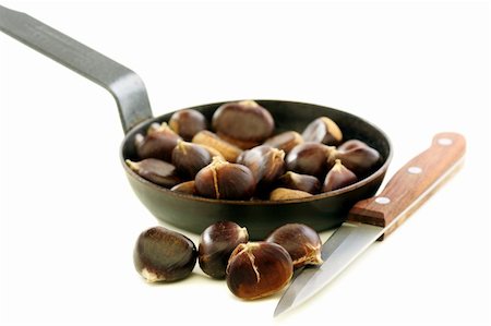 Knife and the chestnuts in a pan on a white background. Stock Photo - Budget Royalty-Free & Subscription, Code: 400-06420818